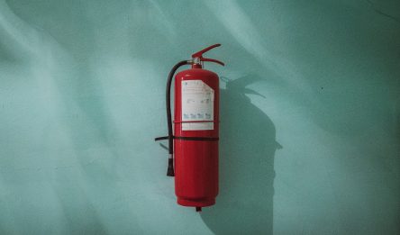 Fire extinguisher connected to wall
