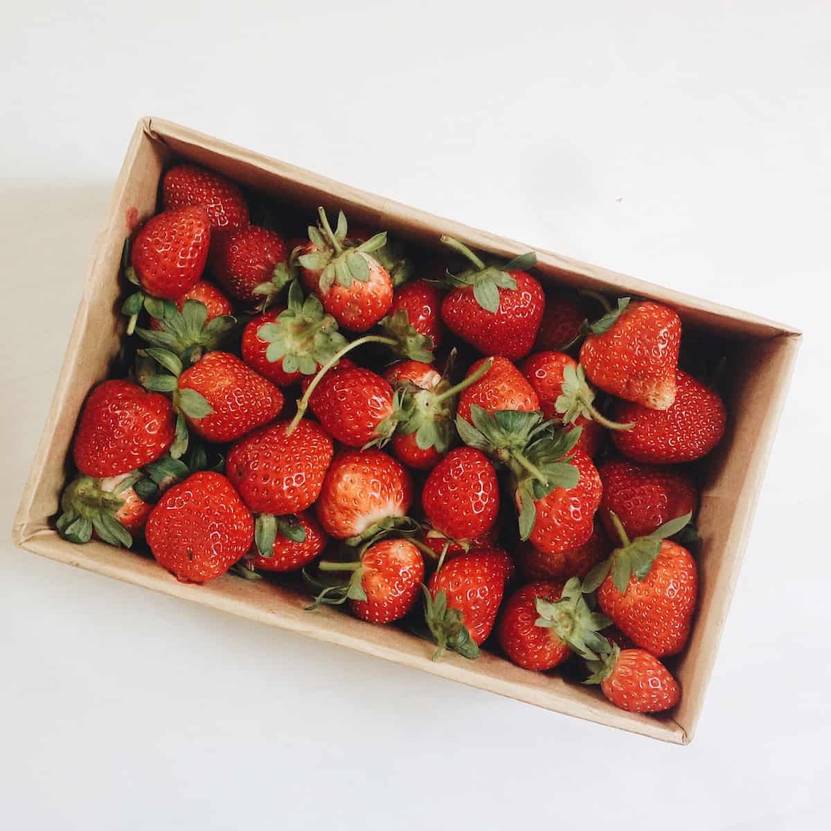 strawberries in white rectangular box